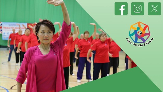 A lady in bright pink leads a Tai Chi class. All students are wearing bright red t-shirts. Faye Tai Chi Friends logo in top right.