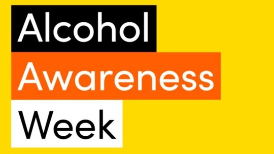 The words Alcohol Awareness Week in black and white letters on a bright yellow background