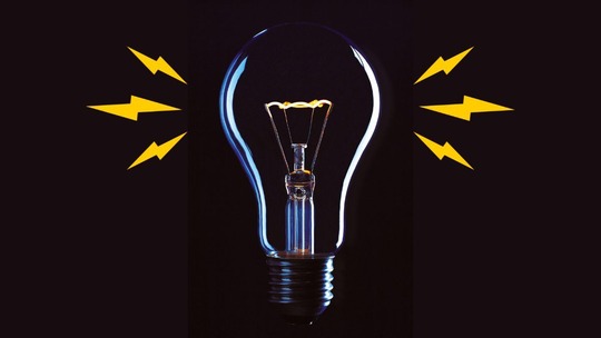 A black background on which there is a blue lightbulb surrounded by yellow zigzags