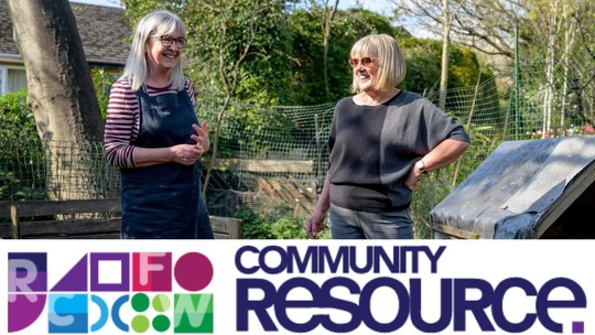 2 older women stand chatting outside in a garden. The Community Resource logo is at the bottom of the image. 