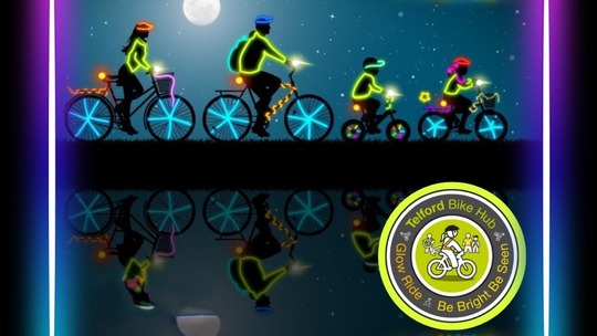 Silhouettes of a family on bikes decorated with neon highlights. The Telford Bike Hub logo appears bottom right.