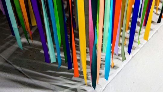 A curtain of ribbons in rainbow colours