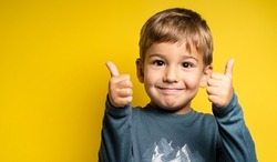 boy with thumbs up