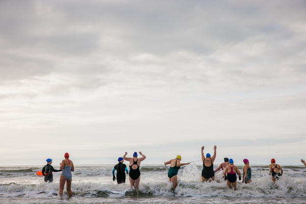 Image of group of women wild swimming in the sea