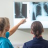 Medical professionals looking at an x-ray