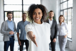 Business woman extending hand for business deal 