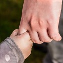 Child holding an adults hand