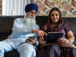 older couple using digital devices 