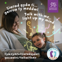 Child with her ear placed on her pregnant mothers stomach