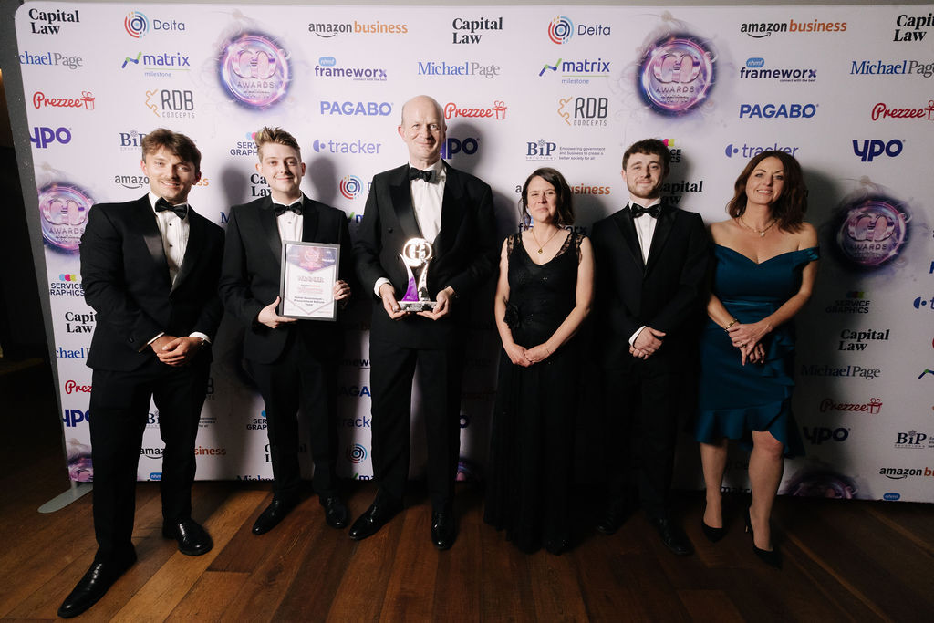 Procurement Team picking up their GO Awards National Award