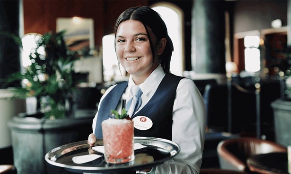 Female waitress holding tray