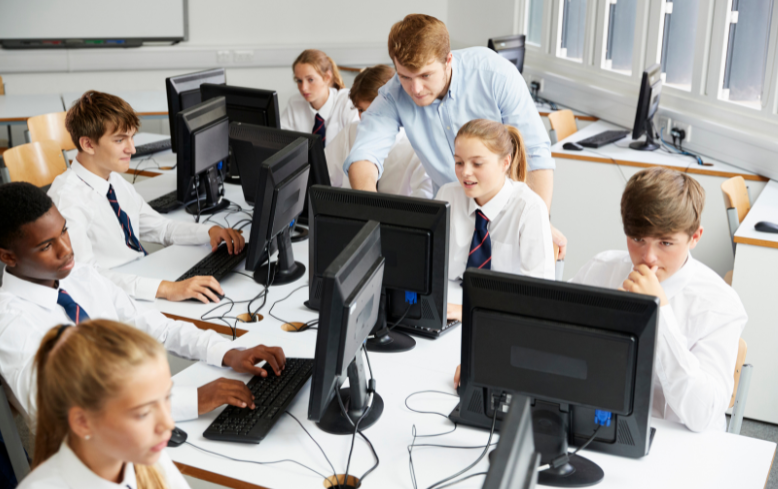 secondary classroom pupils with teacher