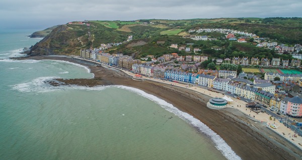 Aberystwyth seafront, houses and hills.