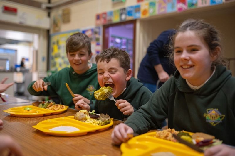 Children enjoying a healthy meal in school