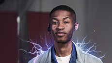 Apprentice stock image of young person smiling confidently at the camera. They have electric sparks at their shoulders.