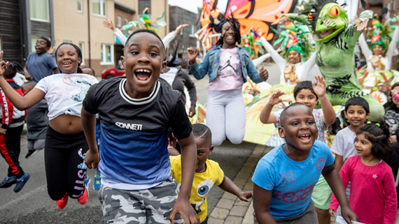 Excited children celebrate Windrush Day