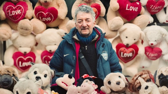 Market trader Larry surrounded by teddy bears