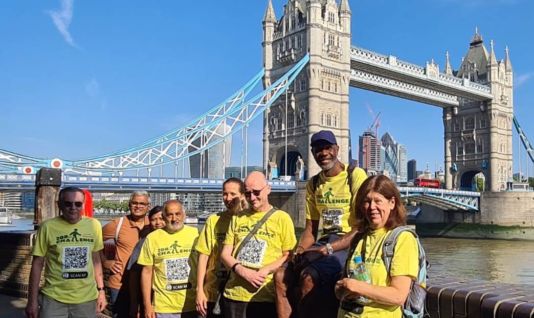 The Loopy Walkers pose in front of Tower Bridge