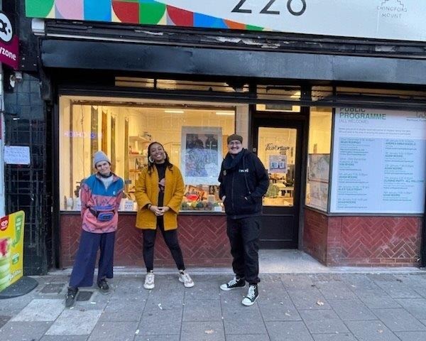 228 Chingford Mount shop front with people standing outside.