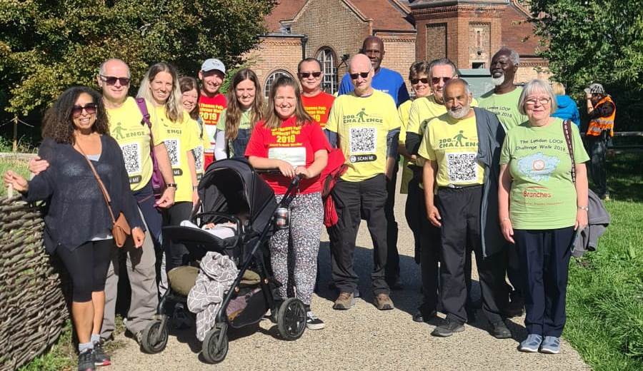 The Loopy Walkers pose in fundraising T-shirts on a walk