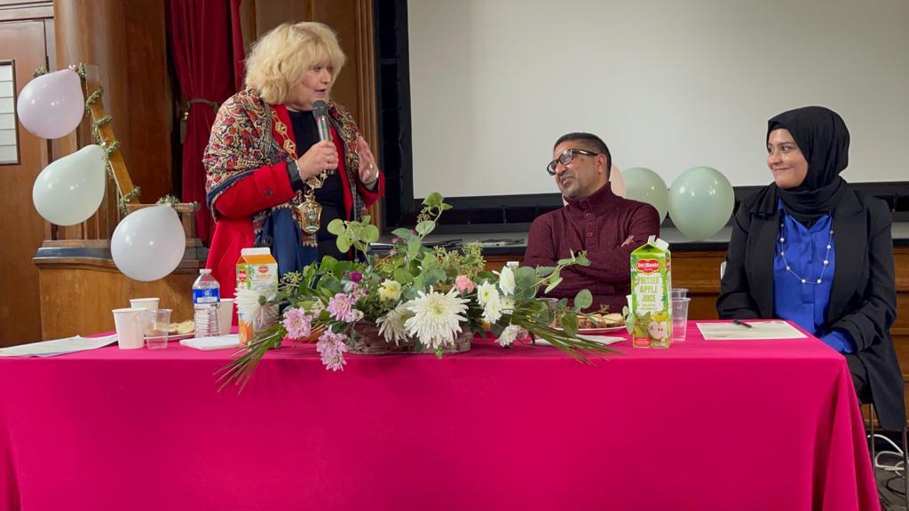 The Mayor of Waltham Forest gives a speech standing next to two people from Blossom 