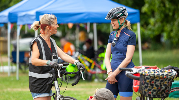 A cyclist gets advice from a Cycle Confident rep at a bike maintenance session