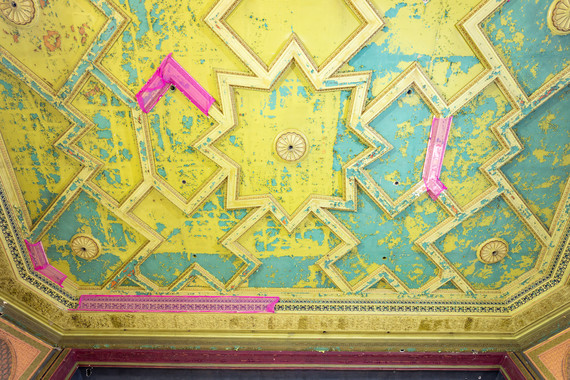 Close up on layers of paint on a ceiling