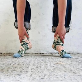 Woman wearing jeans and patterned socks