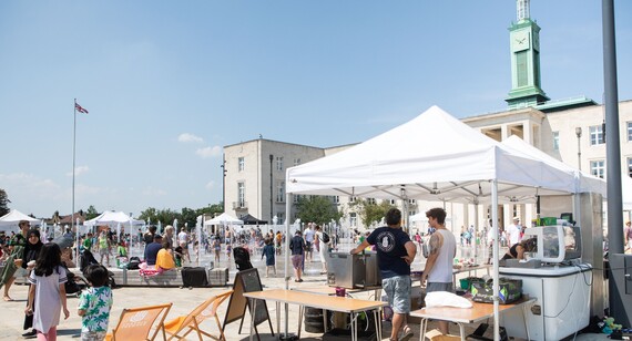 Crowds enjoy the sun at a Fellowship Square market day in front of Waltham Forest Town Hall