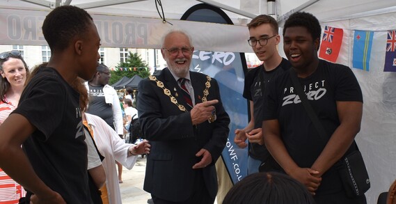 Mayor of Waltham Forest points at one of the Project Zero team in a marquee