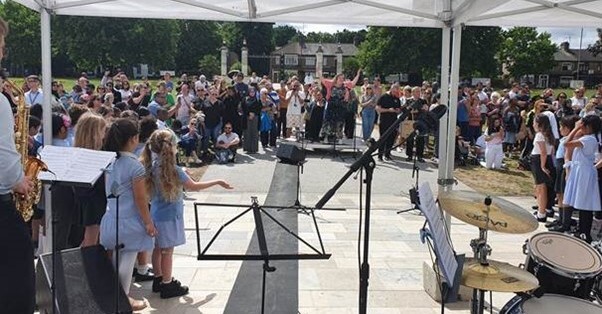 Schoolchildren perform in Fellowship Square