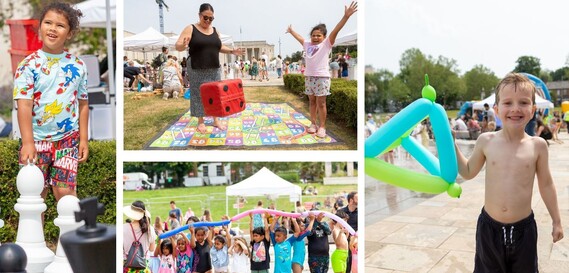 A child plays with giant chess pieces, another with a giant dice, another holds up a balloon number and a group hold a colourful pole