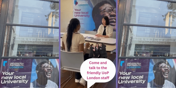 Two women, speaking over a table at the University Of Portsmouth London campus