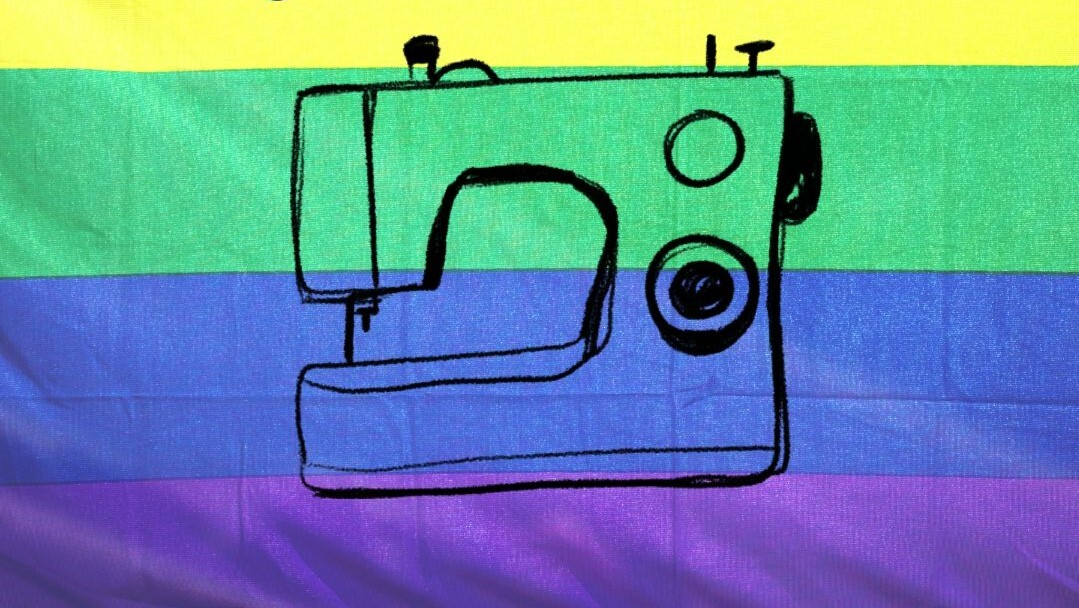 Illustration of sewing machine on a rainbow background