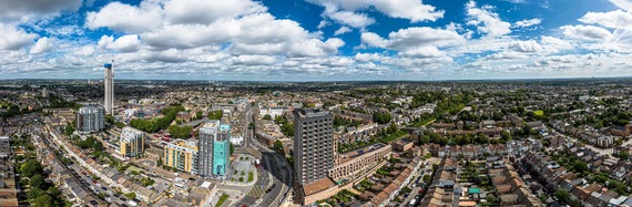 A panoramic view of Waltham Forest looking north, showing blocks of flats, terrace houses and trees