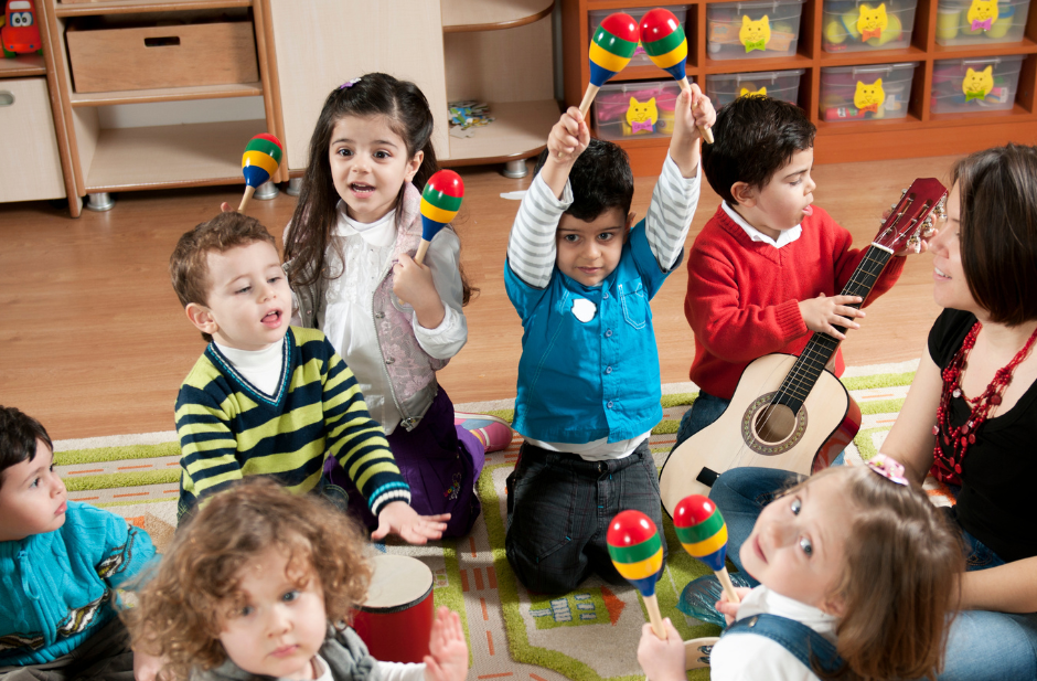 A group of children play together in a classroom