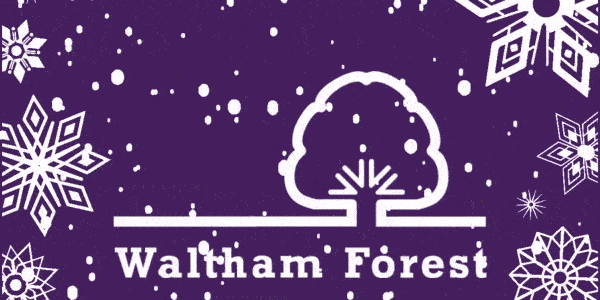 Snow falls on the Waltham Forest Council logo