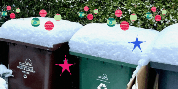 Snow covered garden waste and recycling bins with animated Christmas baubles and stars