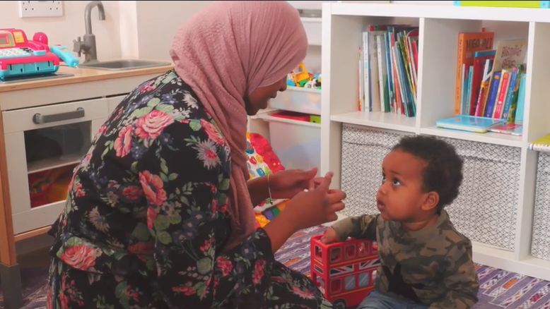 Mum and child singing