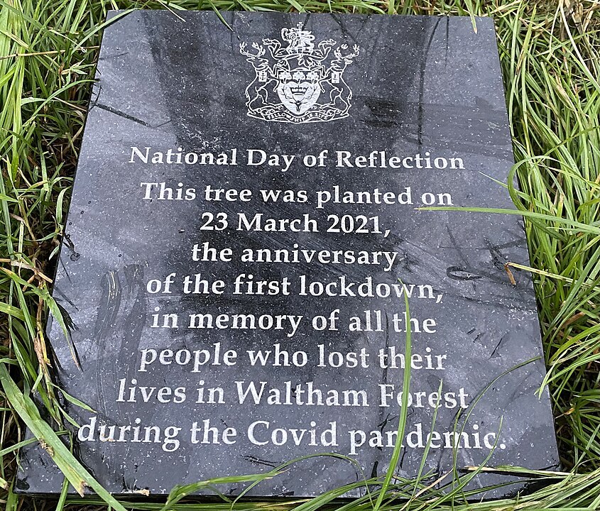 A plaque at the base of tree planted on the anniversary of the first Covid lockdown, 23 March 2021