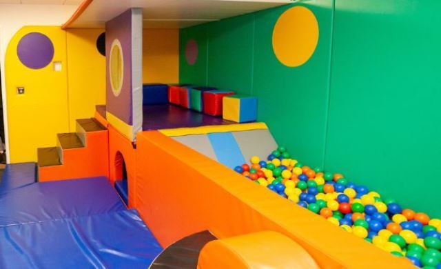 Sensory room at Lester House showing brightly coloured soft play equipment
