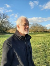 Richard standing in a field