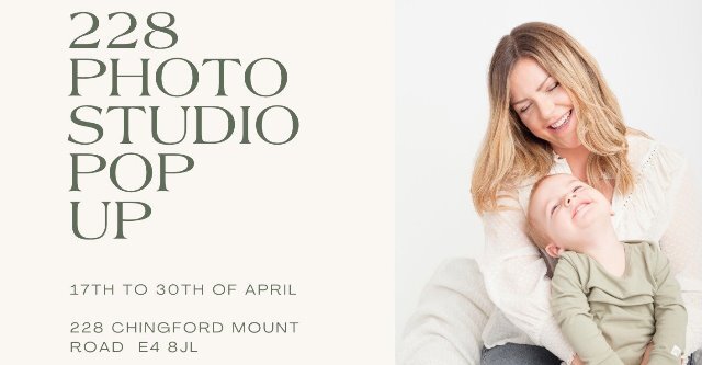 A woman cuddles a child on her lap. They are both laughing