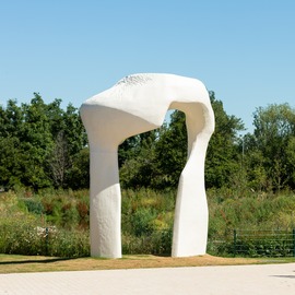 The Arch by Henry Moore, a large white sculpture which looks like a fragment of bone. 