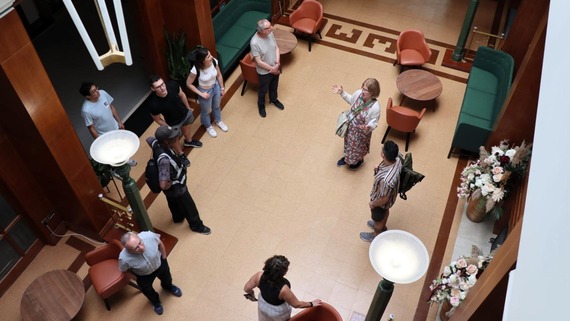 A tour group being shown around the Town Hall