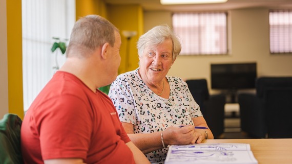 a photo of a person and their carer enjoying their time together