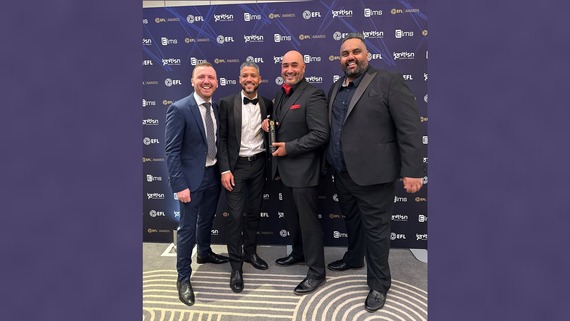 A photo of Punjabi O's representatives posing with their Diversity Award at the 2024-25 EFL Awards