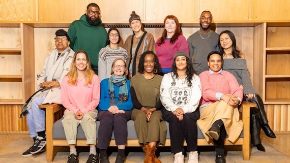 A photo of this year's Make It Happen funding recipients posing on a sofa