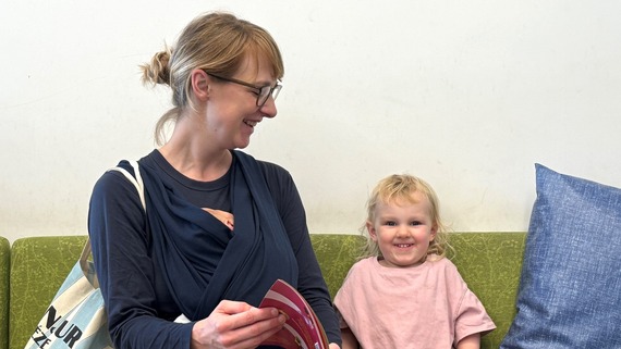 A photo of a mother and a child having a nice smile