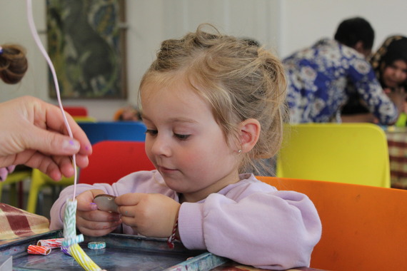 A girl enjoys taking part in creative activities at the William Morris Gallery 